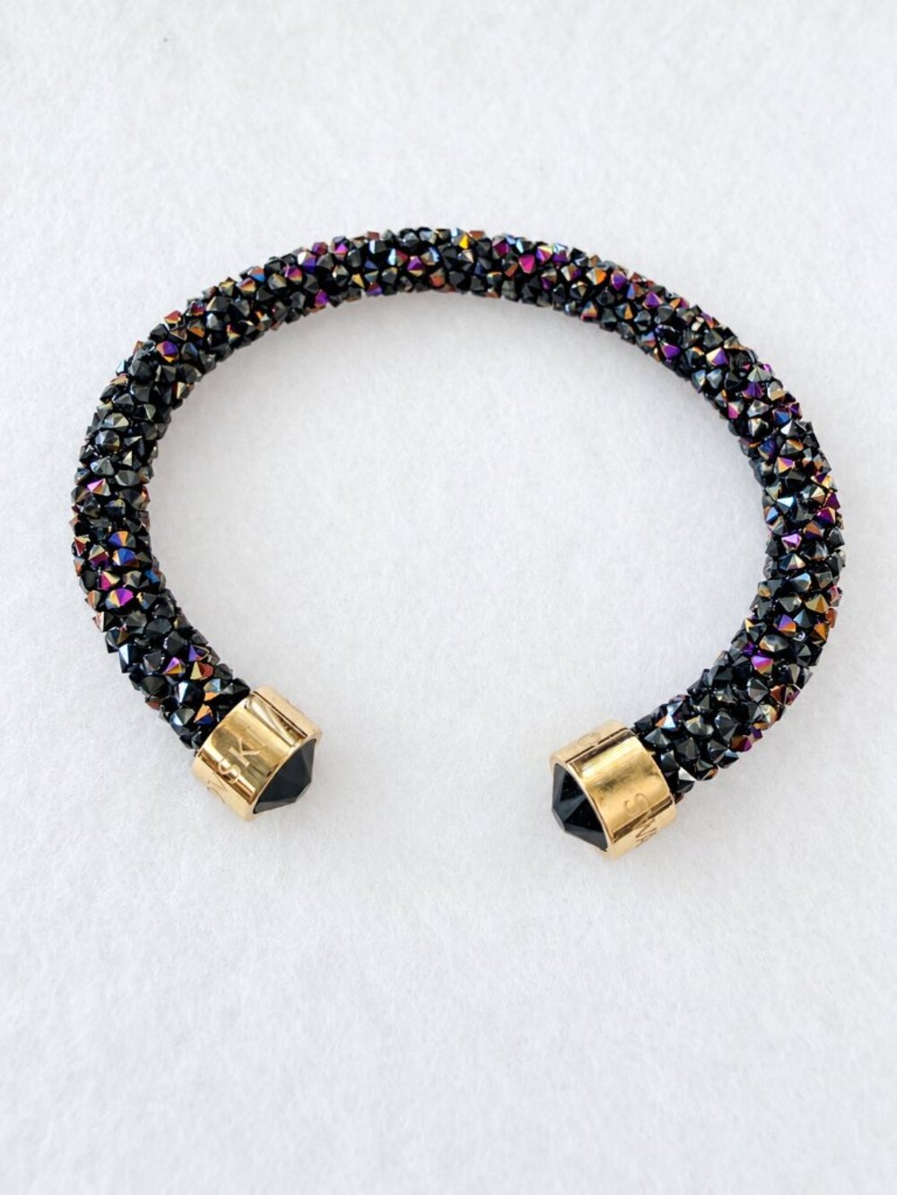 warovski Crystaldust Cuff, Multicolored, with gold-tone ends. Stackable